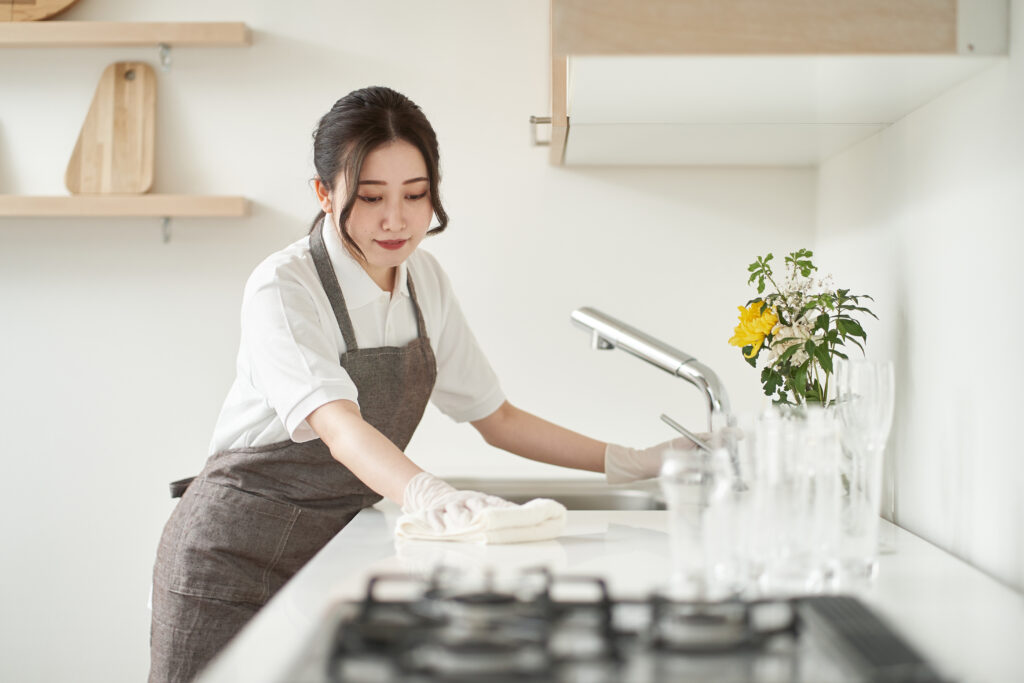 woman wiping the kitchen